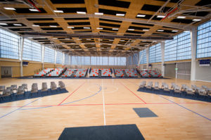 A large indoor stadium laid out with seating